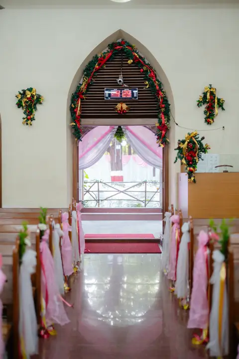 Anosh and Nikita: An aisle dressed in flowers.