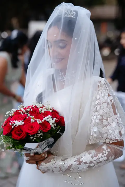 Anosh and Nikita: The veil and the bouquet.
