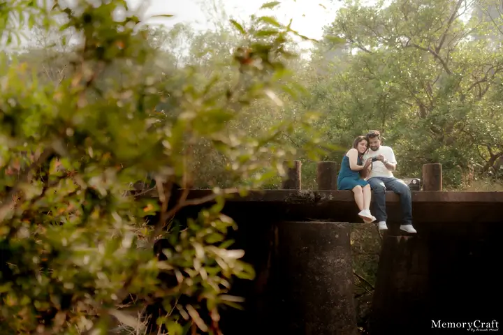 Ashish and Nivedita: Two people in a leafy frame.