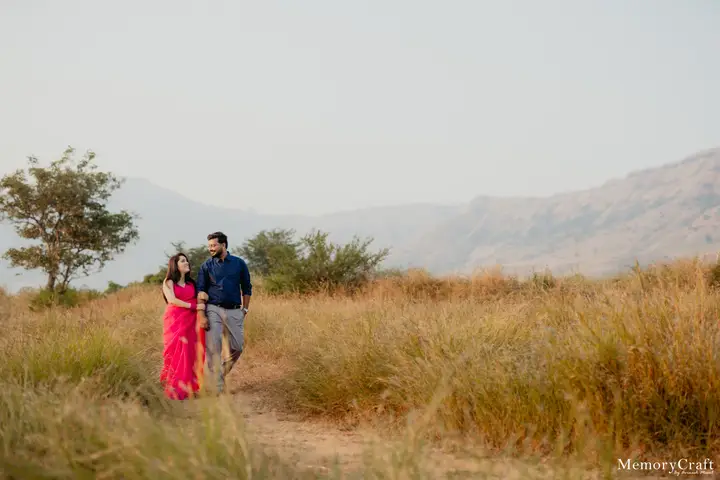 Ashish and Nivedita: Walking through the grass.