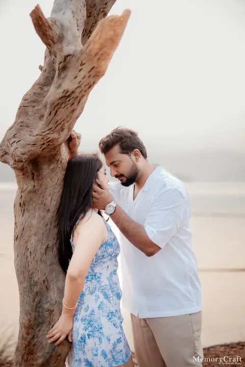 Ashish and Nivedita: A kiss beside the tree.