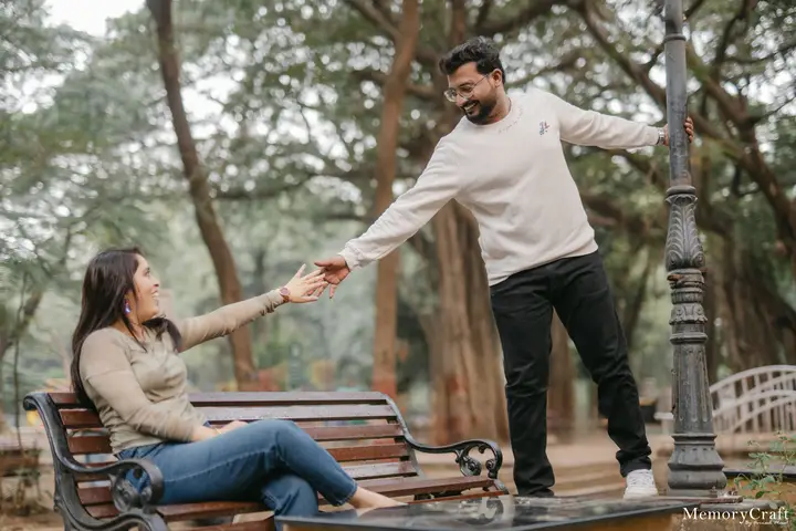 Ashish and Nivedita: A hand from the park bench.