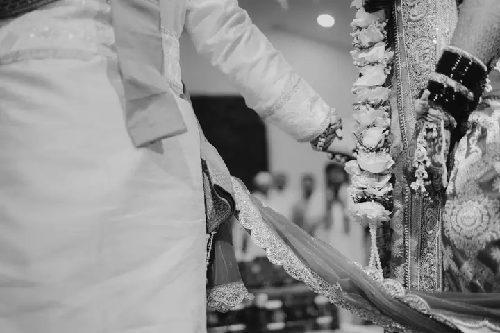 Madhuri and Ashish: Hands held in monochrome.