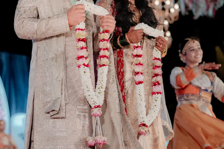 Madhuri and Ashish: The garlands and the hands.