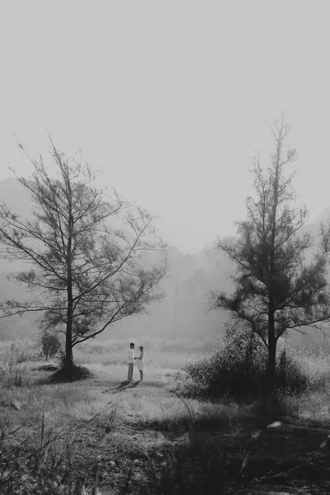 Pratik and Andra: Two people in a wider landscape.
