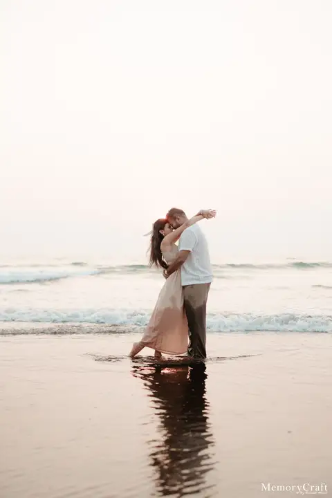 Sanket and Swapnali: A kiss in the reflections.