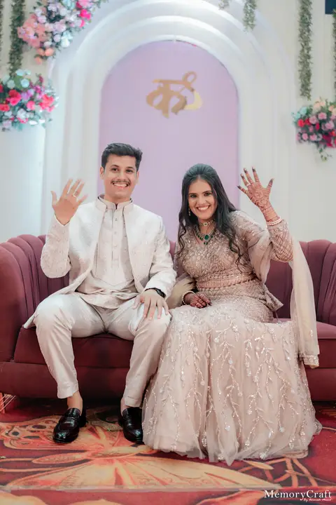 Siddhi and Kunal: Celebrating on stage.