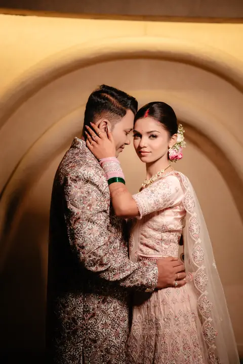 Sumit and Pragati: Framed by warm light.