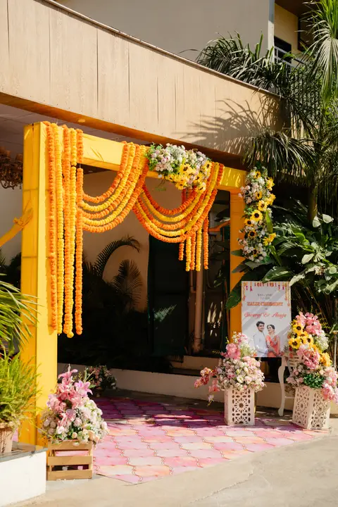 Swaraj and Anuja: A welcome in marigolds.
