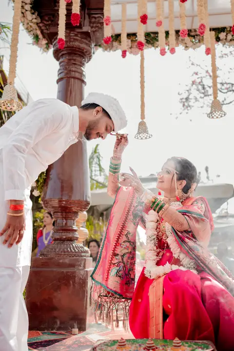 Swaraj and Anuja: A playful wedding moment.
