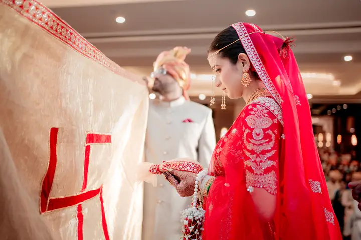 Swaraj and Anuja: Anuja in her red veil.